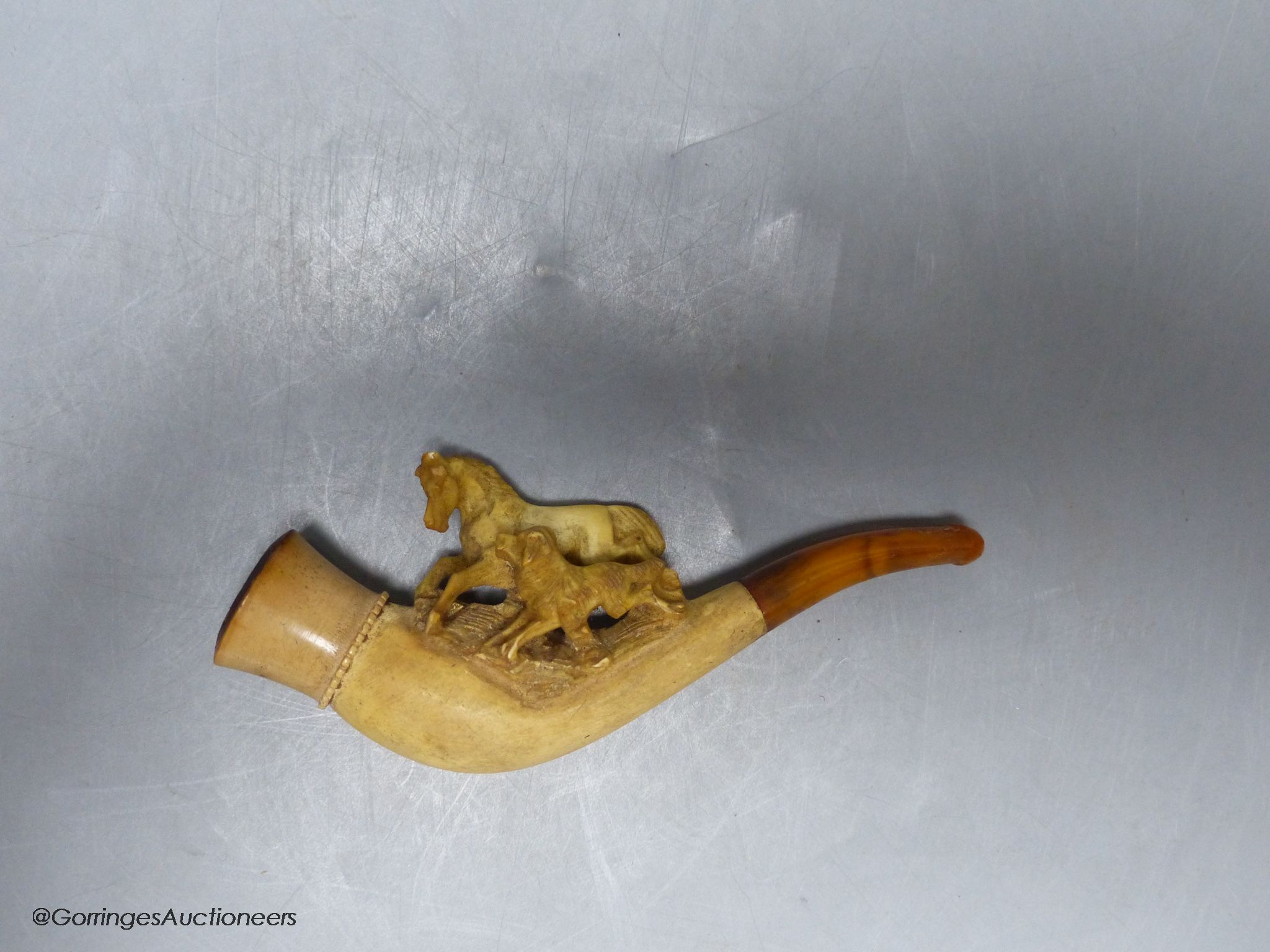 A cased meerschaum pipe
